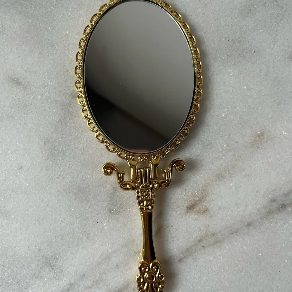 Izzy and Liv gold Fold Away Hand Mirror adjustable